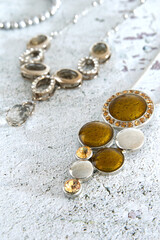 Antique jewelry, vintage necklaces on a rustic background