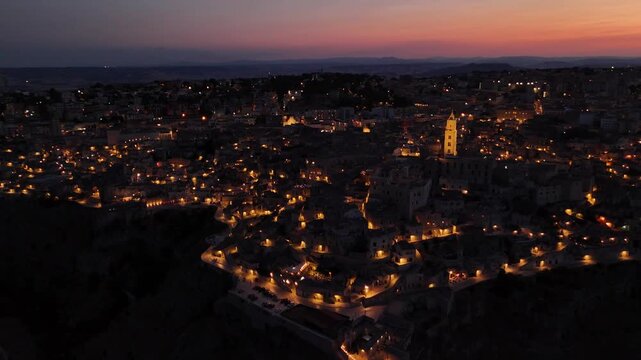 Aerial Evening View of Matera in Basilicata, Southern Italy &ndash; Historic Old Town Illuminated at Dusk