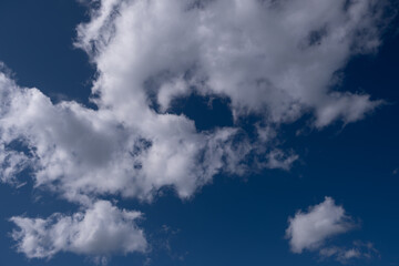 White clouds against a blue sky.