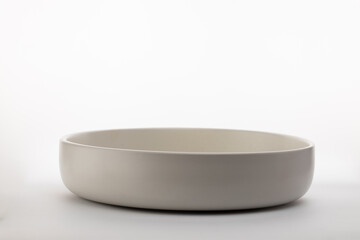 White bowl on white surface.
