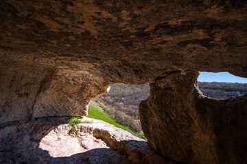 View from the gap in the cave to the valley below.