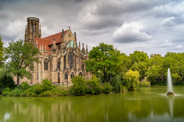 Obraz premium Gothic church Johanneskirche by lake in Stuttgart, Germany