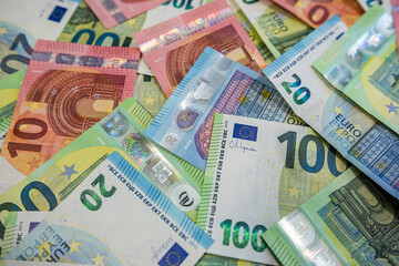 Mixed Euro banknotes background in various values representing cash flow, banking and savings