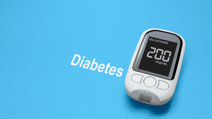 Glucometer with the glucose level on the screen with text of diabetes in a blue background. Copy space. Concept of diabetes or a healthy lifestyle