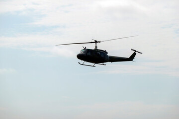 The legendary American military helicopter UH-1 in the clouds