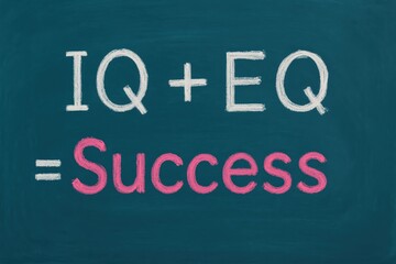 Chalkboard displays IQ plus EQ equals success formula, white and pink chalk illuminating the path to intelligence and emotional achievement