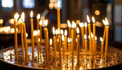 Many lit candles in a church (4)