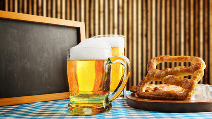 Blackboard with beer mugs and a pretzel loaf with a blue checkered tablecloth or napkin on a wooden background. Copy space. Concept of Oktoberfest. Bavarian German culture festival decoration symbol