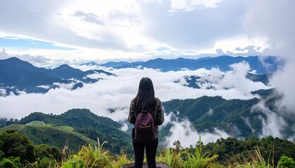 Woman Hiker on Mountain Ridge Above Foggy Valley
