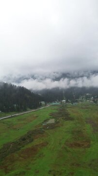 clouds over the mountains drone shot gulmarg