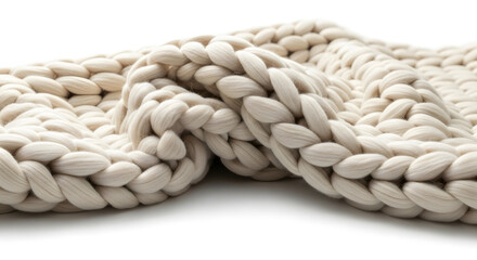 Close-up of an ivory-colored chunky knit blanket revealing the texture, Thick-knit white wool blanket featuring a soft, cozy, and comforting design