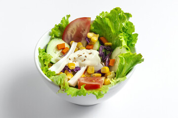 Healthy fresh salad with cucumbers, red onion, and mixed vegetables