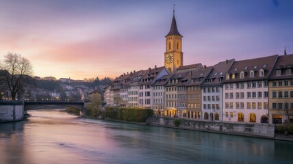 Naklejka premium Bern, Switzerland: A Picturesque Riverside Cityscape at Dusk with a Clock Tower