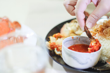Crab Leg in Seafood Dipping Sauce Bowl