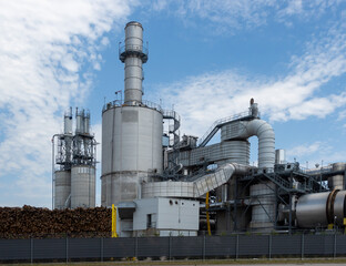 Exterior view of the piping of industrial wood processing plant. Filters, cyclones in industrial dust extraction systems.