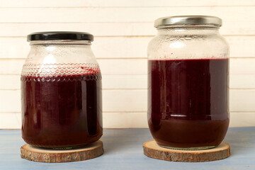 blackberries  jam in glass jars on beautiful background