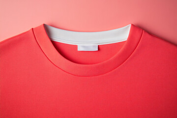 A vibrant red crew neck sweater with a white collar label, perfect for a casual yet stylish look, showcasing simplicity and comfort in a single garment