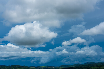 Blue sky fluffy white clouds on summer season bright clear skyline with beautiful cloudscape. Panorama blue sky clouds pattern on daylight with copy space. Cumulus cloudscape air climate sunny day