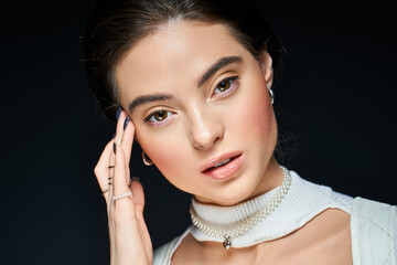 Obraz premium Winter beauty captured in a studio with natural makeup and elegant style