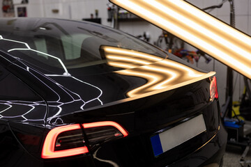 Black Sedan in Workshop for Dent Repair