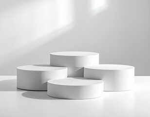 Minimalist White Cylindrical Podiums of Varying Heights on Monochrome Background