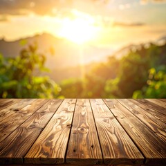 Wooden tabletop with blurred background of a sunset over a green landscape