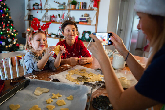 Kids baking cookies during christmas