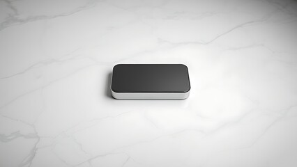 A sleek polished object on marble, abstractly representing modern communication with soft reflections.
