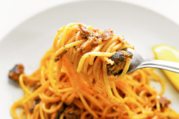 Pasta sardine in tomato sauce.