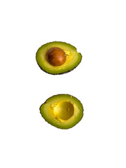 Fresh avocado, cut in half, on a white background