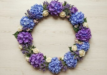 Floral wreath displays hydrangeas roses and lavender on wooden surface perfect for decoration
