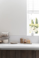 Bright modern kitchen countertop with wooden containers and tableware