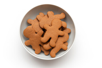 Gingerbread cookies in bowl on white background