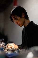 person is repairing bicycle with digital instructions on clean ultrabright background