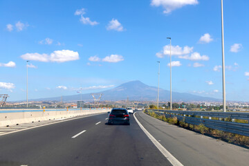 Fototapeta premium Highway view with Mount Etna volcano