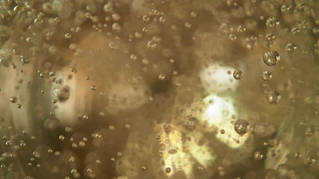 Super Slow Motion Shot of Rising Bubbles in a Fresh Sparkling Drink at 1000fps.
