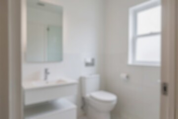 Blurred bathroom interior, wash basin, clean area, modern theme, there is a large mirror above the wash basin, blurry wallpaper