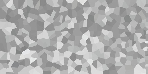 Abstract geometric mosaic pattern with varying shades of gray and white creating a textured, crystalline background for design applications