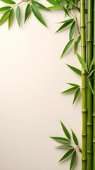 Fresh bamboo stalks with leaves against a serene cream background