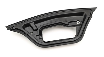 A black plastic car door part on a white background studio