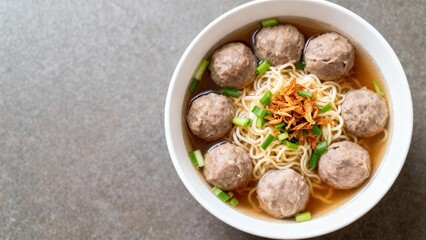 A bowl of flavorful beef meatballs noodles soup, featuring tender meatballs, noodles, and a savory broth.