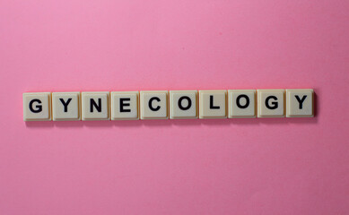 GYNECOLOGY word with alphabet cubes isolated on Pink background

