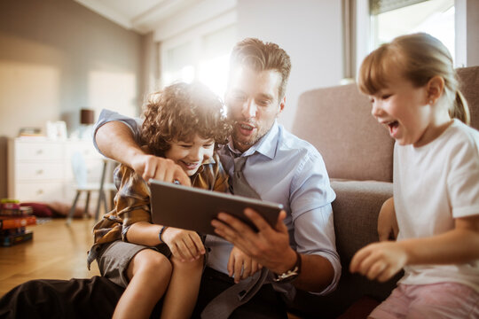Family enjoying tablet together