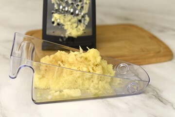 Image of juicy grated apple.