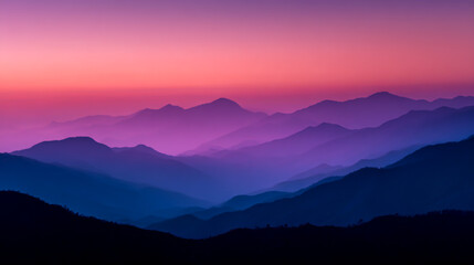 Obraz premium A serene mountain range at sunrise, layers of purple and pink hues blending in the sky