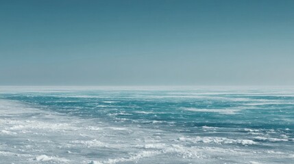 Fototapeta premium A vast icy landscape features dense textured ice sheets with intricate patterns and crevasses,