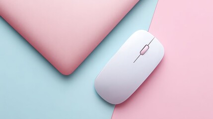 Minimalist workspace setup with a white wireless mouse and pink laptop on blue and pink background.