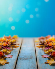 Colorful Autumn Leaves on Wooden Table with Blue Background