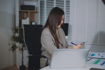 Naklejka premium Portrait of young Hispanic professional business woman standing in office. Happy female company executive, smiling businesswoman entrepreneur corporate leader manager looking at camera using tablet