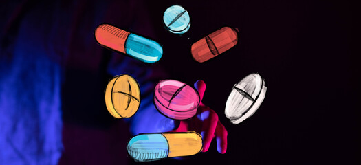 Hand reaching for colorful pills and capsules. Healthcare, medicine, pharmacy concept.